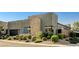 View of modern home showcasing desert landscaping with native plants and rock at 10228 Shell Star Ave, Las Vegas, NV 89135