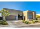 Contemporary home with clean lines, desert landscaping, and a modern design at 10228 Shell Star Ave, Las Vegas, NV 89135