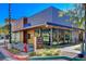 Commercial building with modern architectural elements, including metal cladding, glass storefront, and manicured landscaping at 10228 Shell Star Ave, Las Vegas, NV 89135