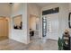 Bright foyer with herringbone floors, high ceilings, and a view into the dining room at 10228 Shell Star Ave, Las Vegas, NV 89135