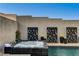 Secluded hot tub nestled beside a modern pool, accented with privacy screens and tasteful landscaping at 10228 Shell Star Ave, Las Vegas, NV 89135