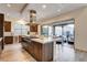 Stylish kitchen with an island, stainless steel appliances, and seamless access to outdoor entertaining spaces at 10228 Shell Star Ave, Las Vegas, NV 89135