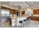 Gourmet kitchen featuring a large island with seating, stainless steel appliances, and sleek countertops at 10228 Shell Star Ave, Las Vegas, NV 89135