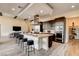Open concept kitchen with a large island, stainless steel hood, and counter seating at 10228 Shell Star Ave, Las Vegas, NV 89135