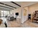 Modern living area with fireplace, built-in shelving, and seamless flow to dining and entertaining spaces at 10228 Shell Star Ave, Las Vegas, NV 89135