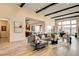 Bright living room boasts wood-look tile floors, high ceilings, and direct access to both the kitchen and outdoor area at 10228 Shell Star Ave, Las Vegas, NV 89135