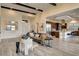 Open living space featuring a modern sectional sofa and seamless flow into the dining and kitchen areas at 10228 Shell Star Ave, Las Vegas, NV 89135