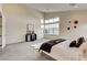 Bright main bedroom featuring high ceilings, large windows, and a modern aesthetic at 10228 Shell Star Ave, Las Vegas, NV 89135
