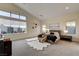 Serene main bedroom with large windows, a plush bed, and modern decor at 10228 Shell Star Ave, Las Vegas, NV 89135