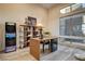 Home office featuring a modern desk, shelving, and a large window with views at 10228 Shell Star Ave, Las Vegas, NV 89135