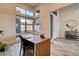 Modern home office with large windows, high ceilings, and a stylish desk at 10228 Shell Star Ave, Las Vegas, NV 89135