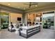 Inviting outdoor patio with comfortable seating and a view of the modern interior at 10228 Shell Star Ave, Las Vegas, NV 89135