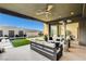 Modern patio with comfortable seating and a view of the pool area featuring a stylish water feature at 10228 Shell Star Ave, Las Vegas, NV 89135