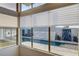 Beautiful pool area with water feature and stylish landscaping viewed through large windows at 10228 Shell Star Ave, Las Vegas, NV 89135