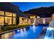 Stylish outdoor space with a pool, hot tub, and outdoor kitchen, ideal for entertaining guests at 10228 Shell Star Ave, Las Vegas, NV 89135
