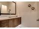Stylish powder room with vessel sink, modern vanity, and decorative wall sconces at 10228 Shell Star Ave, Las Vegas, NV 89135
