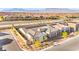 Aerial view of a single-Gathering home highlighting its desert landscaping, solar panels, and proximity to the neighborhood at 10906 Mila Landing Ave, Las Vegas, NV 89166