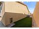 Exterior view of the home showcasing the artificial lawn and landscaping along the perimeter at 10906 Mila Landing Ave, Las Vegas, NV 89166