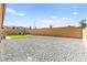 Extensive backyard features gravel landscaping and a patch of well-maintained lawn at 10906 Mila Landing Ave, Las Vegas, NV 89166