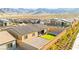 Spacious backyard with low-maintenance landscaping, a patio area, and a view of the surrounding desert landscape at 10906 Mila Landing Ave, Las Vegas, NV 89166