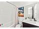 Bright bathroom features a large tub and shower combination and artistic decor at 10906 Mila Landing Ave, Las Vegas, NV 89166