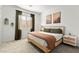 The Primary bedroom boasts natural light, tasteful decorations, and an ensuite bath at 10906 Mila Landing Ave, Las Vegas, NV 89166