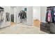 Walk-in closet with well-organized shelving, storage, and access to laundry at 10906 Mila Landing Ave, Las Vegas, NV 89166