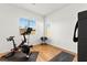 Bright room featuring exercise bike, yoga mats, and dumbbells, perfect for a home gym at 10906 Mila Landing Ave, Las Vegas, NV 89166