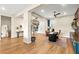 Open floor plan featuring hardwood floors and a light-filled foyer leading to multiple rooms at 10906 Mila Landing Ave, Las Vegas, NV 89166