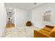 Bright living room features neutral carpet, natural light, and access to the rest of the home at 10906 Mila Landing Ave, Las Vegas, NV 89166