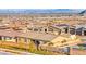 View of a neighborhood showcasing the community's well-maintained landscaping and city views at 10906 Mila Landing Ave, Las Vegas, NV 89166