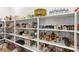 Spacious walk-in pantry with multiple shelves and plenty of storage for food and kitchen essentials at 10906 Mila Landing Ave, Las Vegas, NV 89166
