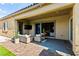A cozy outdoor patio with access to the interior, featuring comfortable seating and stylish decor at 10906 Mila Landing Ave, Las Vegas, NV 89166