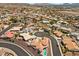 The aerial perspective highlights a suburban community featuring single-Gathering homes and curved roads at 1105 Malachite Ct, Henderson, NV 89011