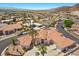 A beautiful single Gathering home featuring a circular driveway and lush landscaping at 1105 Malachite Ct, Henderson, NV 89011