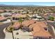 A beautiful single Gathering home featuring a circular driveway and lush landscaping at 1105 Malachite Ct, Henderson, NV 89011
