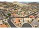The aerial shot shows a residential area with a mix of desert landscaping and homes at 1105 Malachite Ct, Henderson, NV 89011