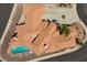 The aerial shows the home's terracotta roof, a curved pool, and desert landscaping at 1105 Malachite Ct, Henderson, NV 89011