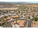 The aerial reveals an established residential area with well-kept lawns and mature trees at 1105 Malachite Ct, Henderson, NV 89011