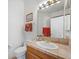 Bathroom featuring tile countertop, a white toilet and single sink at 1105 Malachite Ct, Henderson, NV 89011