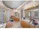 Main bathroom with double sink vanity, tile floors, and a glass enclosed shower at 1105 Malachite Ct, Henderson, NV 89011