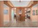 Bright entryway with tile flooring, decorative pillars, and a view into multiple rooms of the house at 1105 Malachite Ct, Henderson, NV 89011