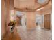 Spacious entryway with tile floors, high ceilings, and views to the dining room and hallways at 1105 Malachite Ct, Henderson, NV 89011