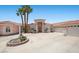 Charming single Gathering home showcases a circular driveway and lush landscaping at 1105 Malachite Ct, Henderson, NV 89011