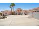 Charming single Gathering home showcases a circular driveway and lush landscaping at 1105 Malachite Ct, Henderson, NV 89011