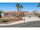 Charming single Gathering home showcases a circular driveway and lush landscaping at 1105 Malachite Ct, Henderson, NV 89011