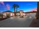 Charming single Gathering home showcases a circular driveway and lush landscaping at 1105 Malachite Ct, Henderson, NV 89011