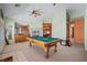 Open game room with a pool table and views of an adjacent living space at 1105 Malachite Ct, Henderson, NV 89011