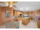 Well-lit kitchen featuring custom wood cabinets, granite countertops, and an open layout to the breakfast nook at 1105 Malachite Ct, Henderson, NV 89011