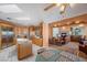 Open kitchen featuring an island, stainless steel appliances, and a view into the living area with a fireplace at 1105 Malachite Ct, Henderson, NV 89011